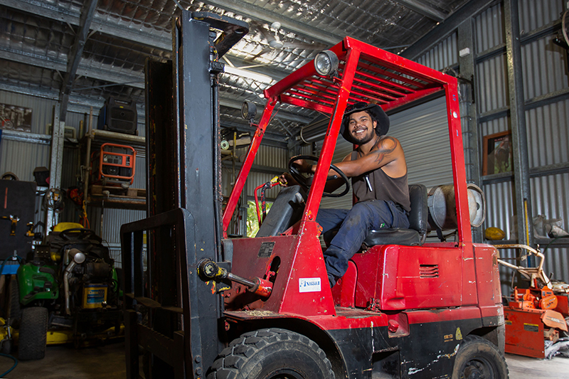 TRACQS participant Kain using a forklift